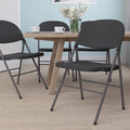 Flash Furniture 4 Pack HERCULES Series 330 lb. Capacity Black Plastic Folding Chair with Charcoal Frame
